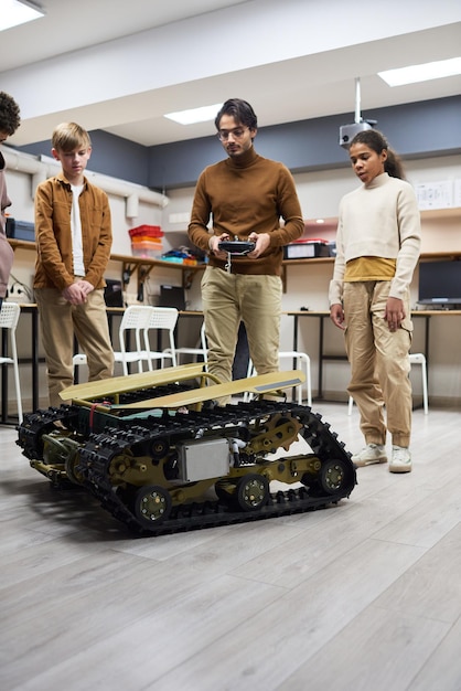 Teacher with students making a big robotic machine