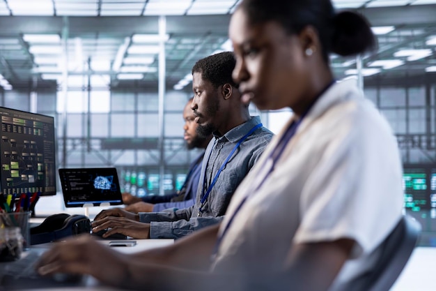 Team of IT specialists in server farm establishment repairing equipment