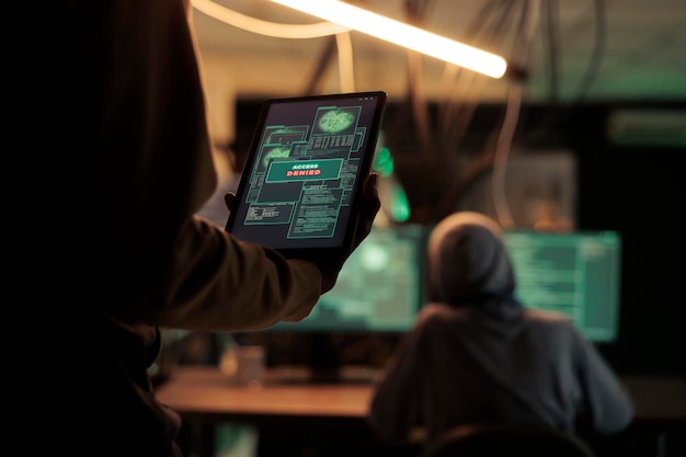 thief reading access denied message on tablet