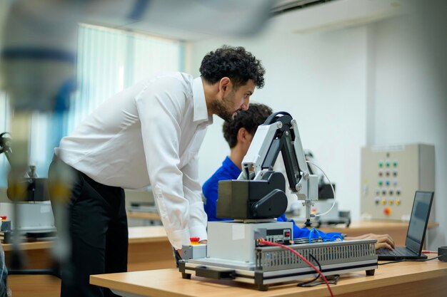 Trainee Robotics engineer learning with Programming and Manipulating Robot Hand