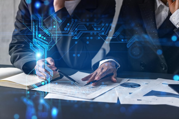 Two businesswoman working together in office Technology holographic illustration double exposure