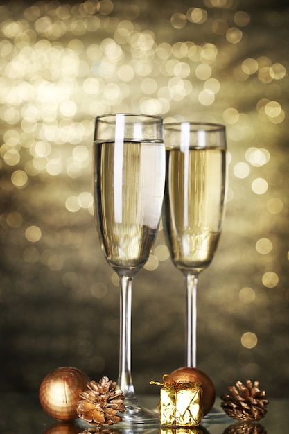 two glasses of champagne on shine background
