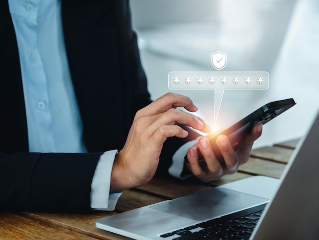 Two steps authentication 2FA concept 2023 Shield and asterisk icons code showing on smart phone while using computer for validate password Identity verification cyber security technology