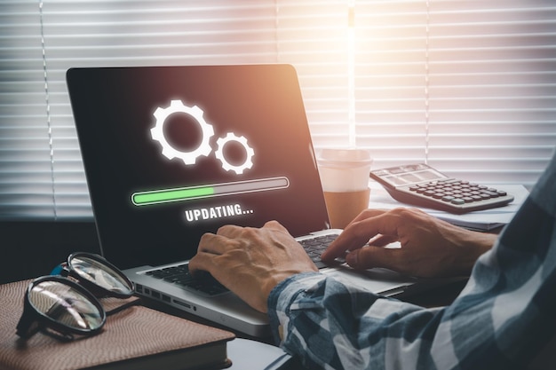 Update progress concept Person waiting for installing update process with loading bar icon on virtual screen on laptop computer