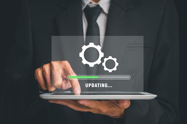update progress concept person waiting for installing update process with loading bar icon on virtual screen on tablet computer