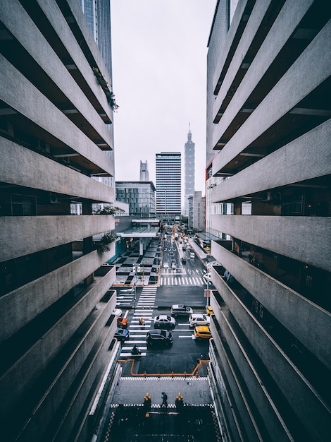 vehicles on road in city against sky