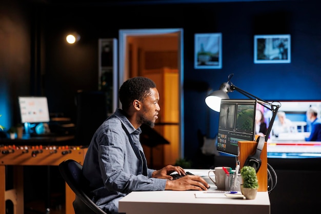 Video editor creating visual effects on film montage at home