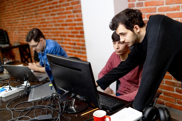 Website design. Programmers working in a software develop company office. Developing programming and coding technologies concept