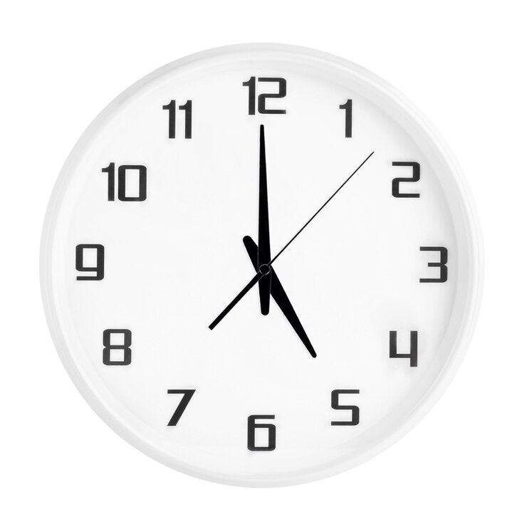 Photo white round office clock showing five o'clock isolated on white. blank white clock showing 5 pm or 5 am time