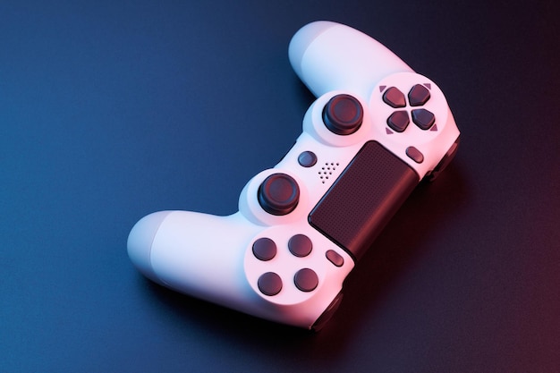 White video game controller joystick for game console isolated on black background Gamer control device closeup