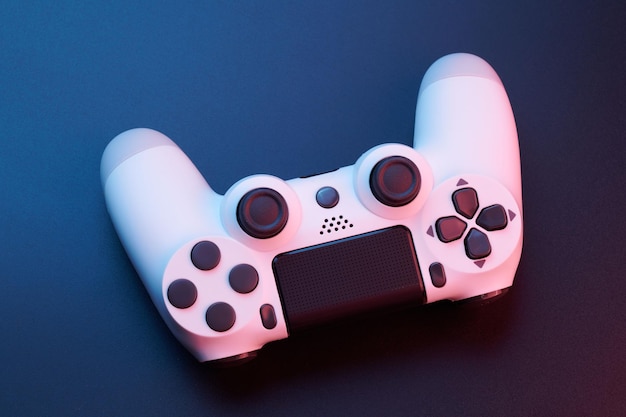 White video game controller joystick for game console isolated on black background Gamer control device closeup