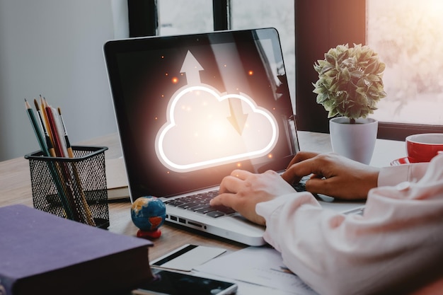 Woman hand using laptop computer with cloud computing icon Cloud computing concept Backup Storage Data Internet networking and digital Share global technology conceptx9