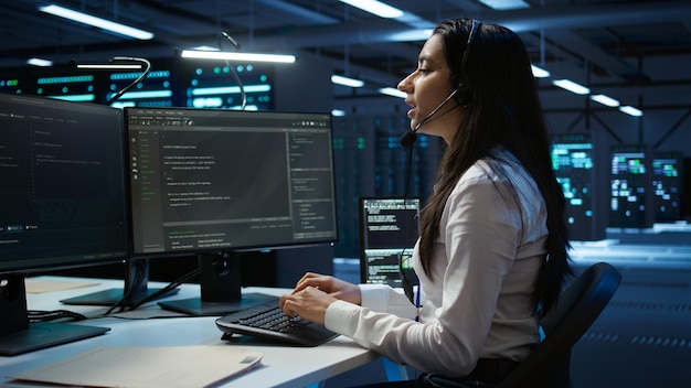 worker in server farm establishment oversees infrastructure systems