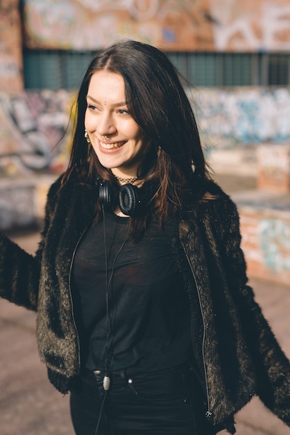 young beautiful woman listening to music with headphones
