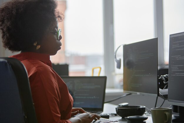 young curly software developer working on fixing bugs