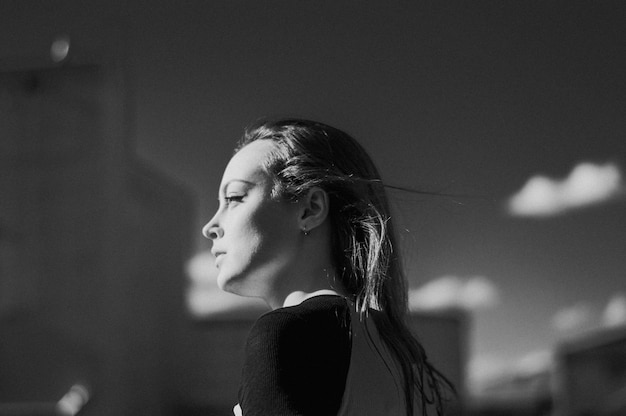 young woman looking away outdoors