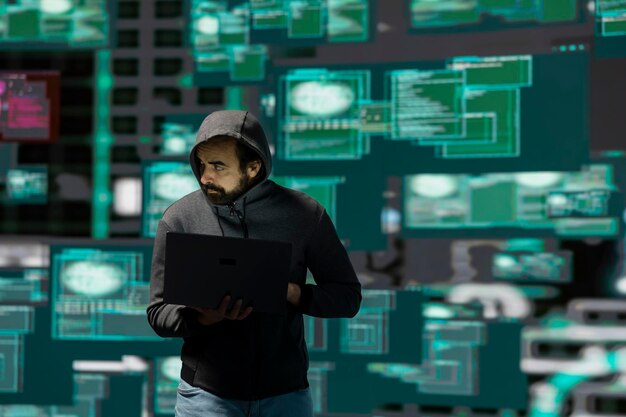 digital attacker using coding and threat detection evasion to launch malware