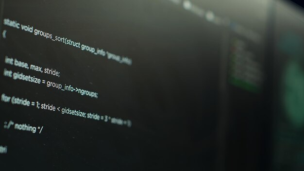 extreme close up shot of lines of code displayed on computer monitors
