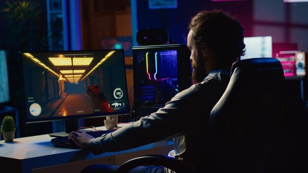 gamer sitting on gaming chair battling flying robots with futuristic gun in singleplayer shooter