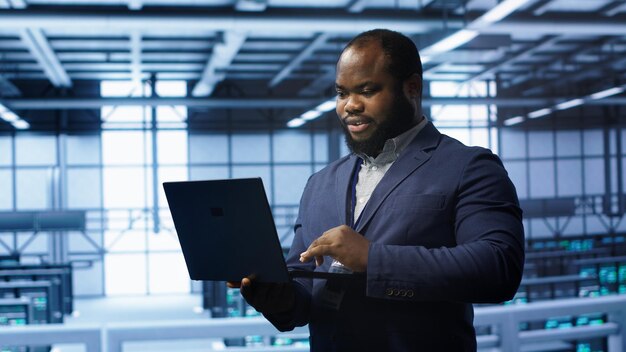 IT professional in server room looking for network issues