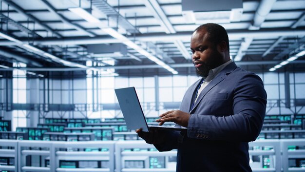 IT professional in server room looking for network issues