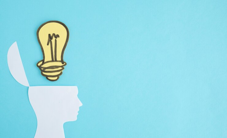 Miễn phí Photo light bulb over the open head on blue background