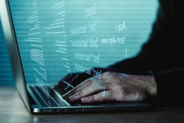 programming background with person working with codes on computer