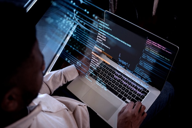 programming background with person working with codes on computer