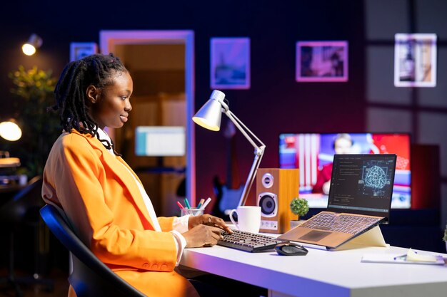 Remote tech support specialist working from home doing checkup on AI systems