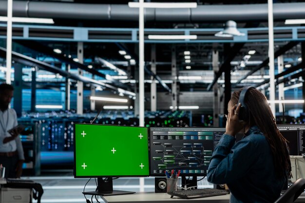 servers room employee wearing audio headset using mockup pc