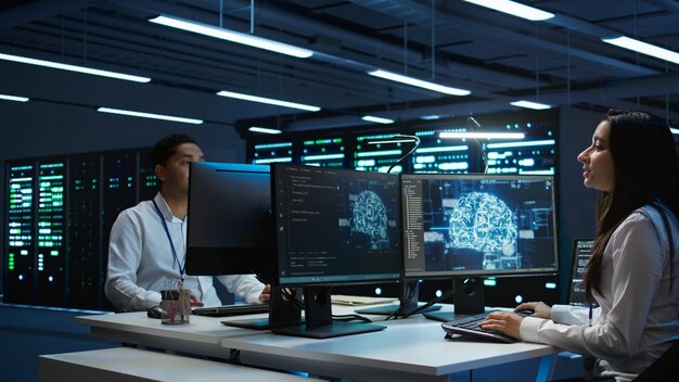 Team of engineers using AI tech on computer to do checkup in server room