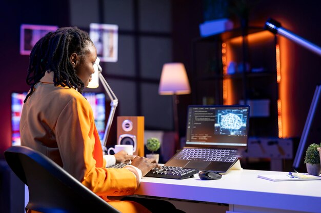 teleworking programmer using laptop for artificial intelligence computing