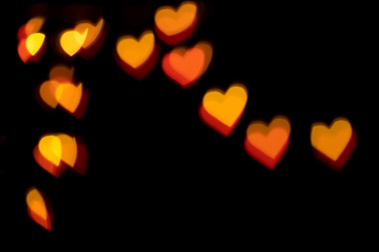 Ilmainen Kuva bokeh-tausta punaisilla sydämillä
