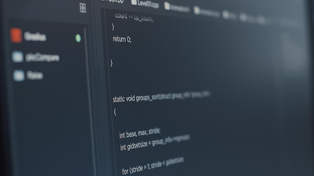 Closeup of computer screen of software developer typing programming language in it startup agency. Display concept of system engineer writing source code. Scrolling text of database functions script.