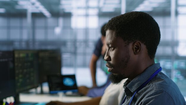 Focus on server hub employee developing disaster recovery plans