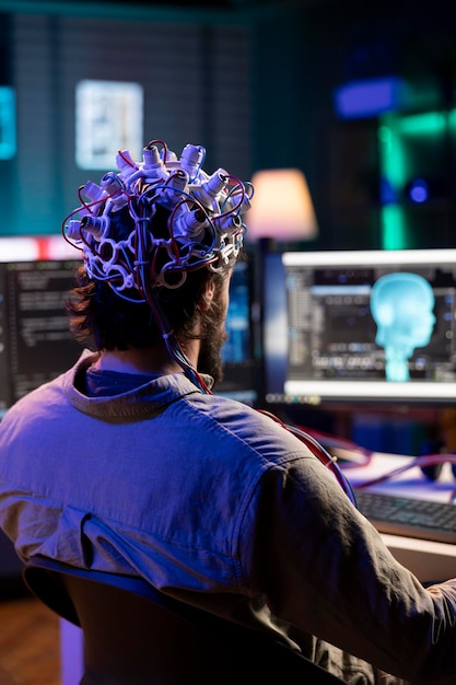 IT admin controlling computer functions using mind helped by EEG headset