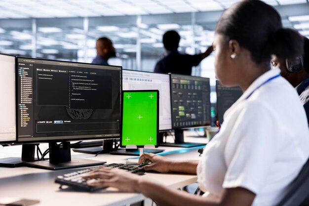 Server room computer scientist using green screen tablet
