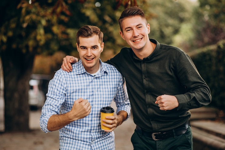 Ilmainen Kuva young adults guys walking together inpark