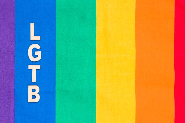 Photo gratuit abréviation lgbt sur la bande bleue du fond arc en ciel