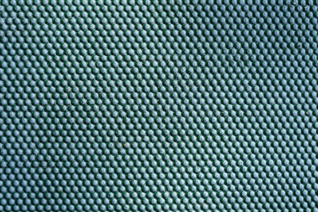 Abstrait métal vert. Texture de points de fer sur un mur métallique extérieur.