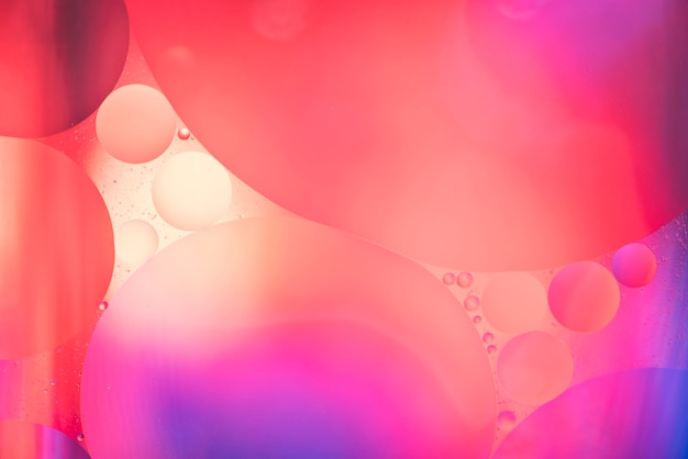 Photo gratuite abstrait rouge et rose avec des bulles
