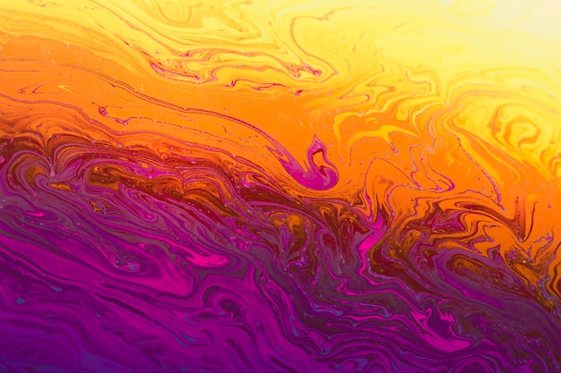 Abstrait violet, orange et jaune scintillant
