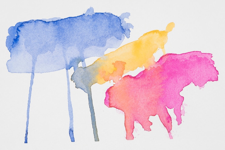 Photo gratuit abstraits taches bleues, jaunes et roses de peintures sur papier blanc