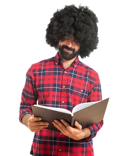 Afro man reading book