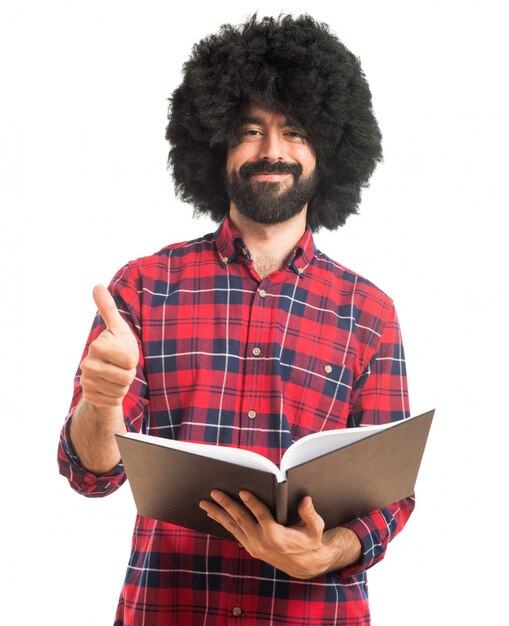 Afro man reading book