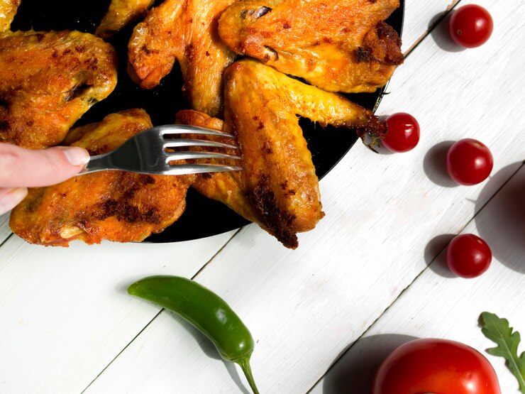 Photo gratuit ailes de poulet cuites aux herbes