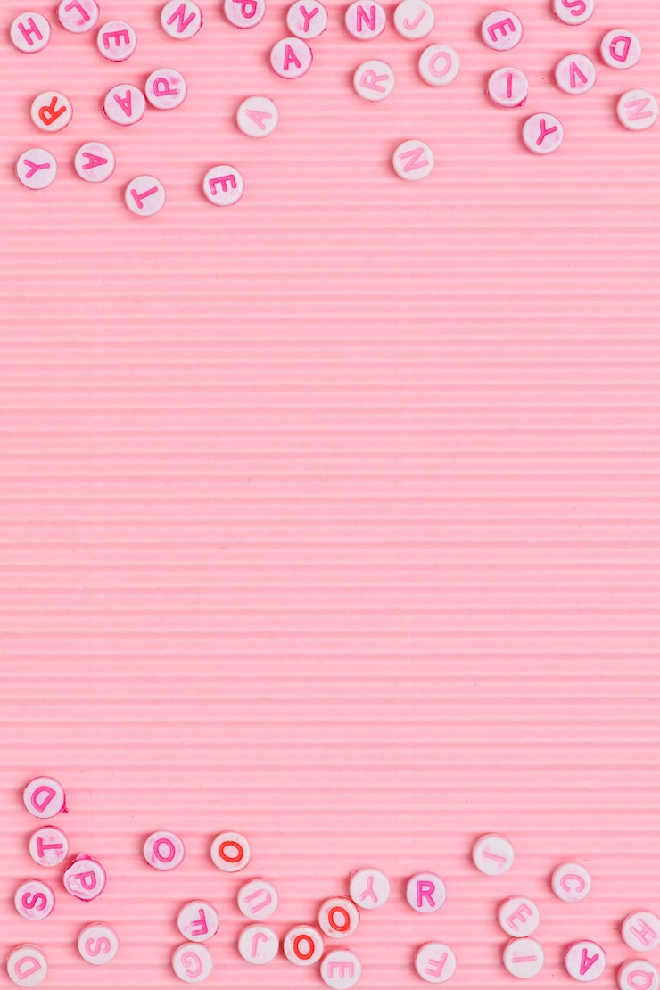 Photo gratuit alphabet perles frontière fond rose