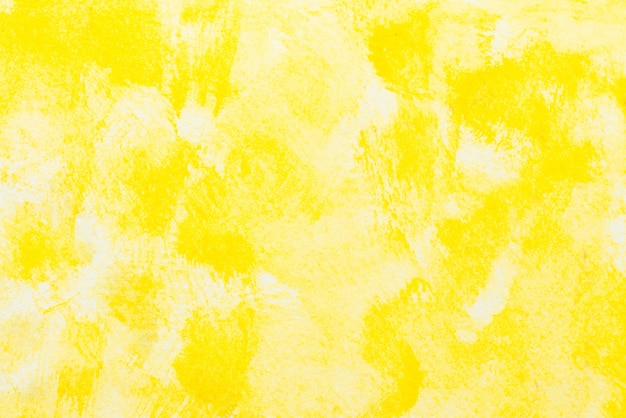 Photo gratuite aquarelle abstraite jaune texturé sur fond de papier blanc