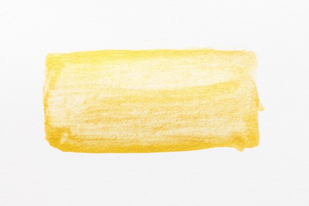 Aquarelle abstraite jaune texturé sur fond de papier blanc