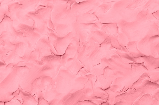 Argile rose fond texturé art créatif à la main coloré style abstrait